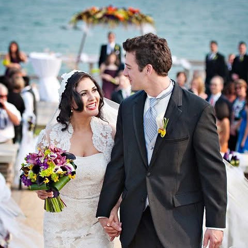 Mike and Vania walking down the aisle on their wedding day in 2011