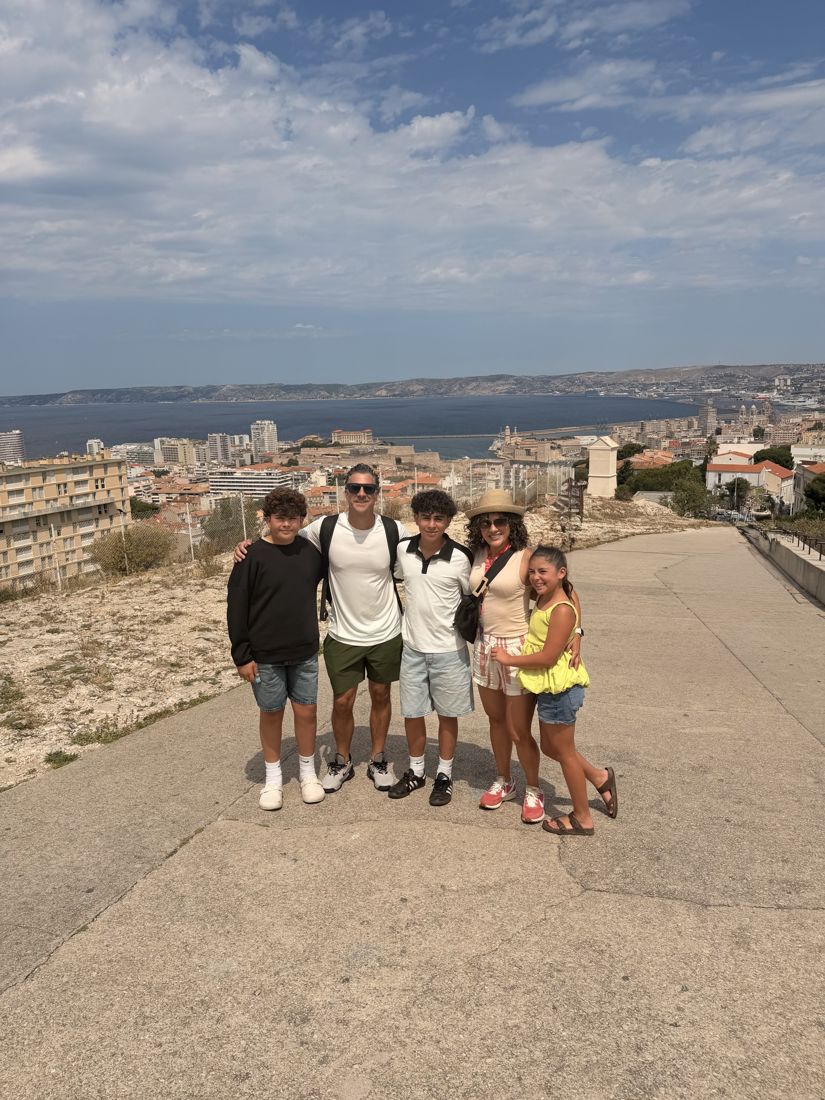 The family at a lookout above the sea