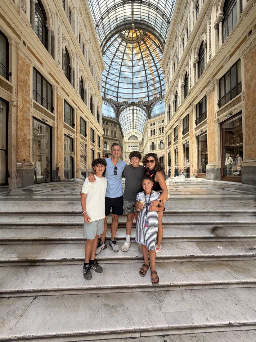 The family on the steps of a grand old building
