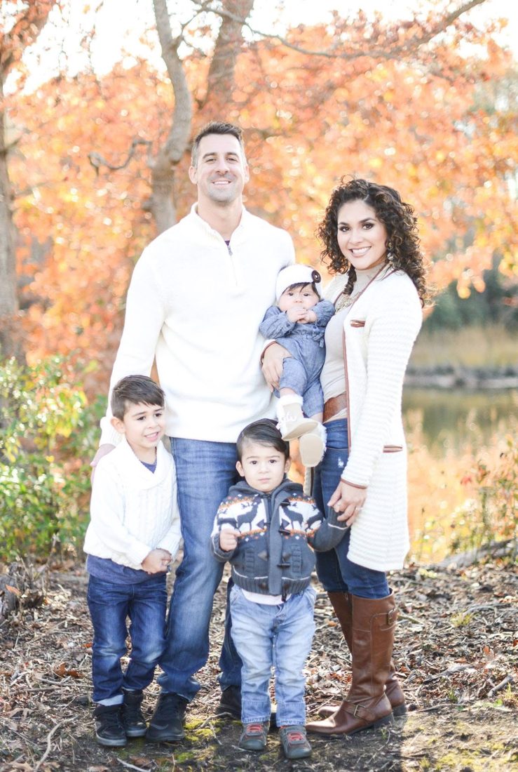 Mike, Vania and the kids by the water in the fall